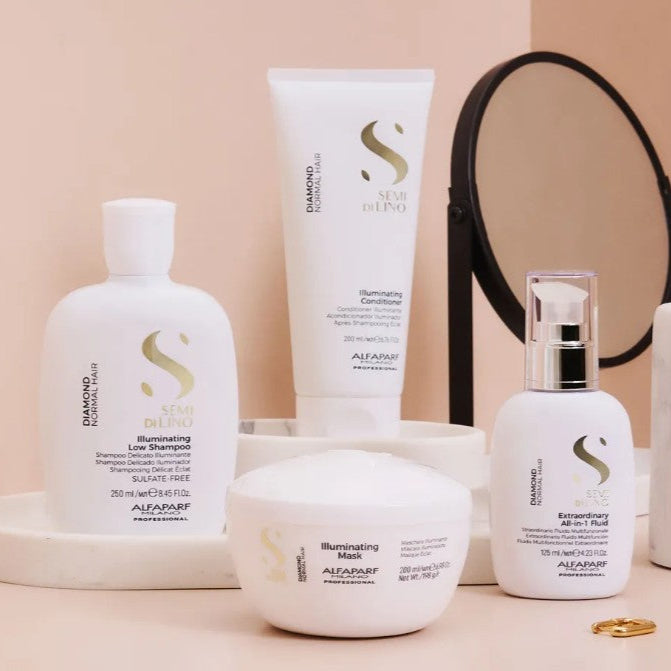 Set of Alfaparf hair care products including shampoo, conditioner, and serum on a beige background.